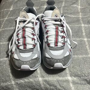 White and Gray Sneakers with Red Accents